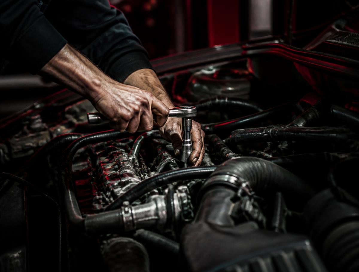 Mechanic working on an engine bay
